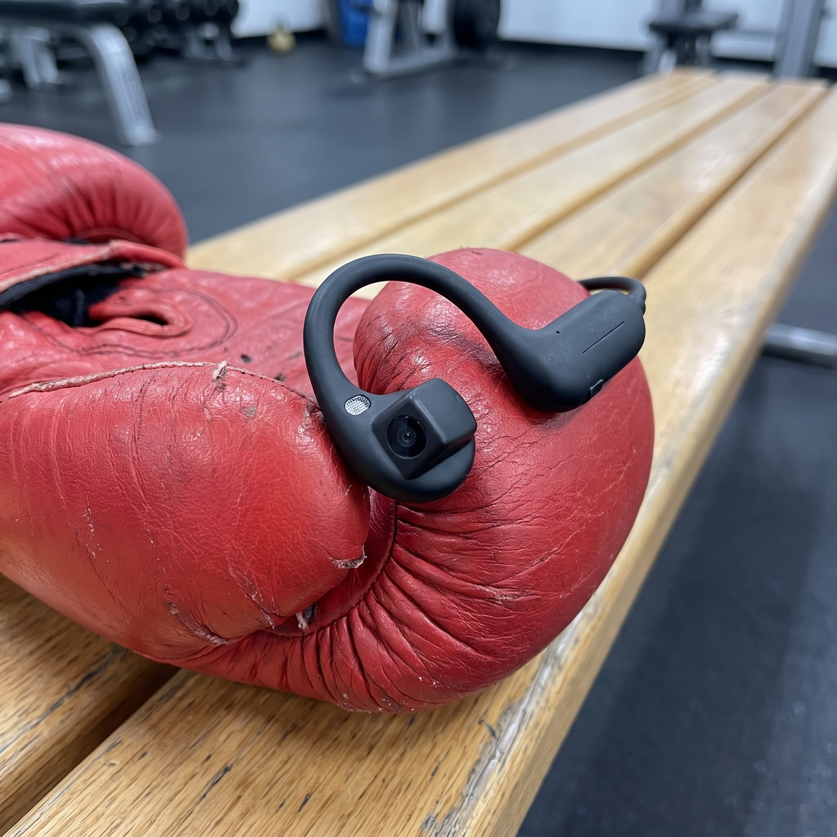 Close-up of BoxerBuds earbud on a boxing glove